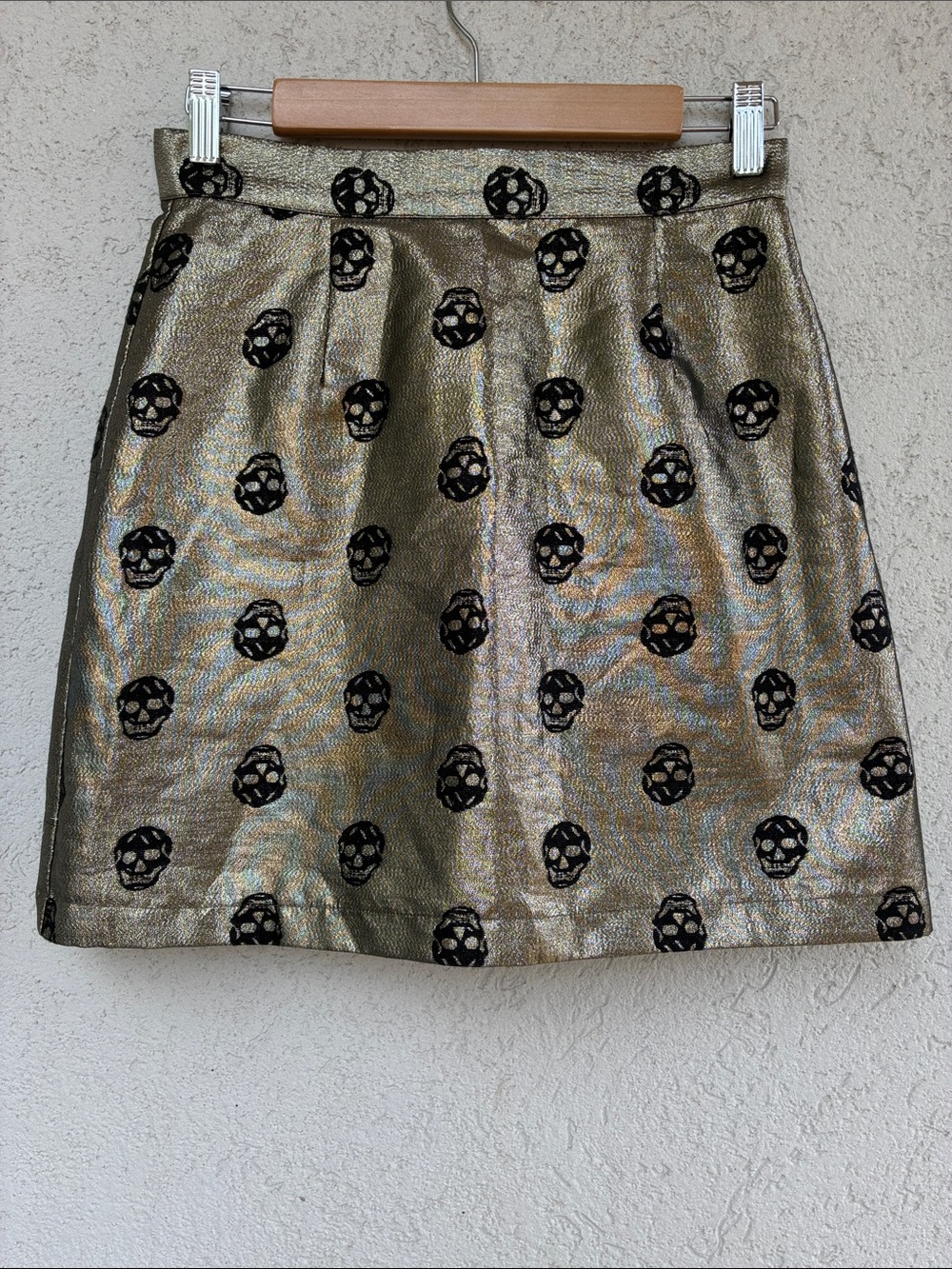 Modcloth Gold metallic A-line  mini skirt with black skull print